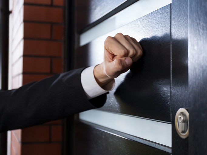 Hand Knocking On The Door